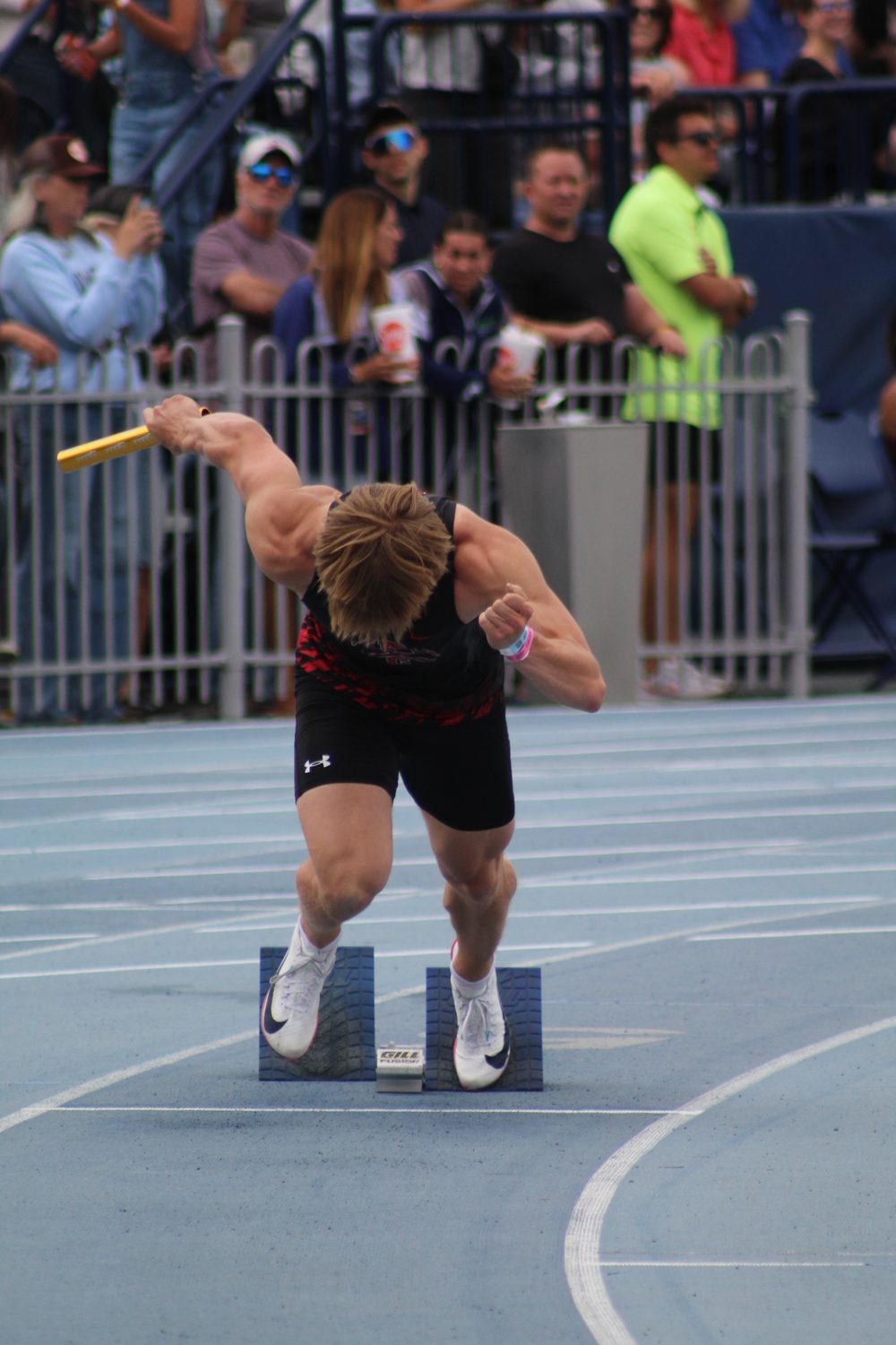 Brian exploding out of the blocks on a relay leg